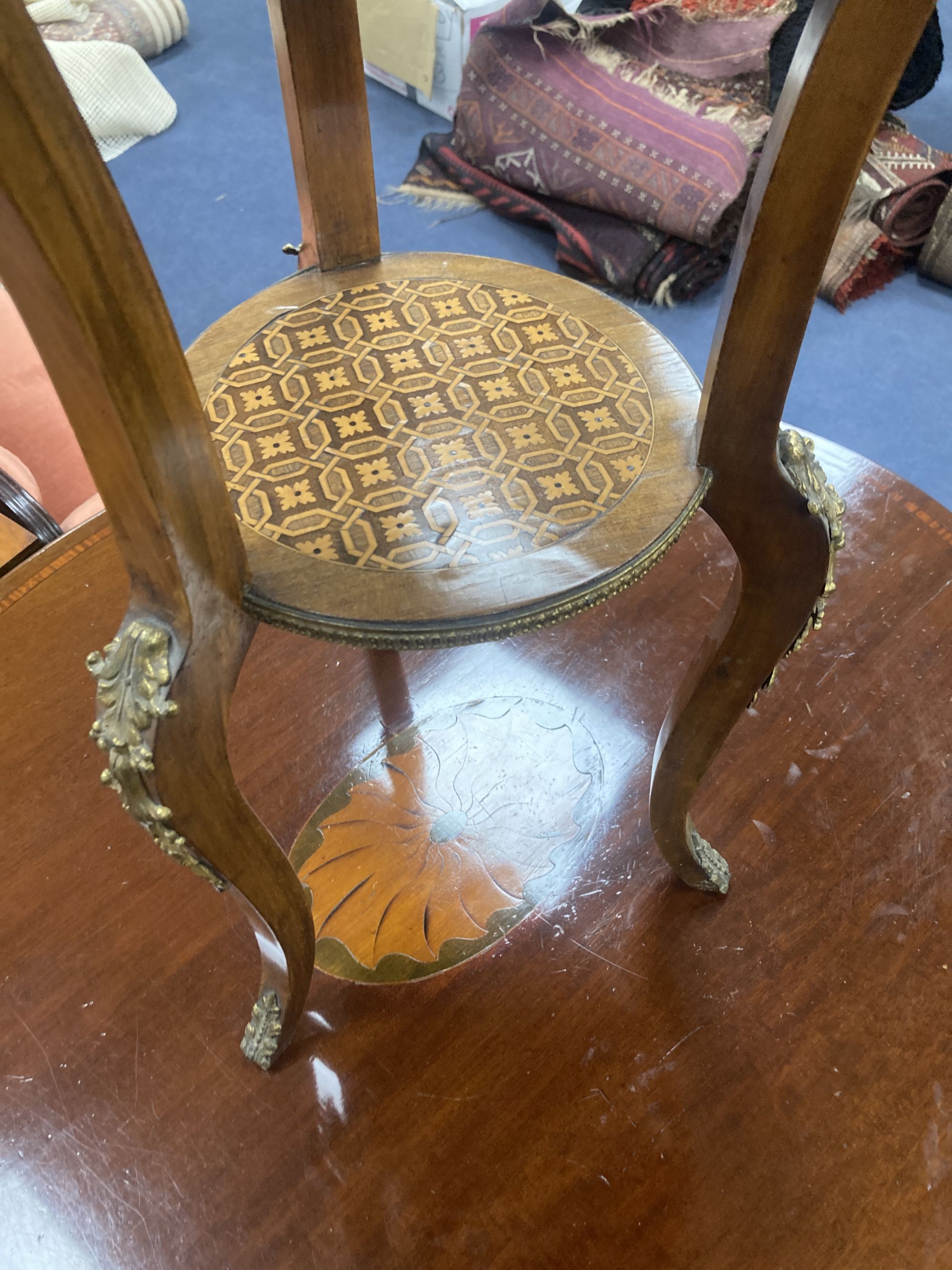 A Louis XVI style inlaid mahogany and ormolu mounted two tier gueridon, diameter 45cm, height 76cm